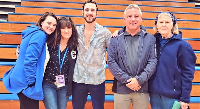 CHS Varsity Basketball coach Jordan Glover and family congratulating him on his team making it to the playoffs.