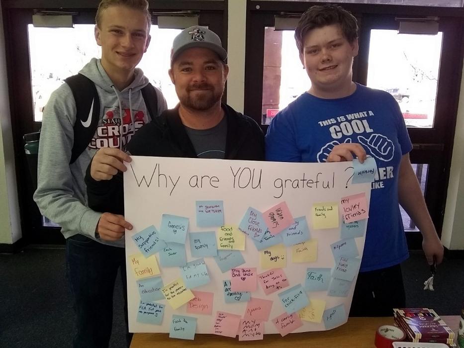CHS students and FCA area representative Tim Plummer displaying some beautiful thoughts during the FCA Root Beer float giveaway.