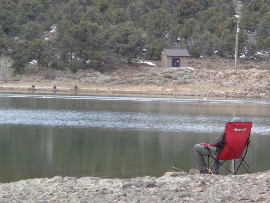 Indian Creek Reservoir. Fellow angler use distancing to fish. There are 3 anglers on the other shore 20 feet apart.