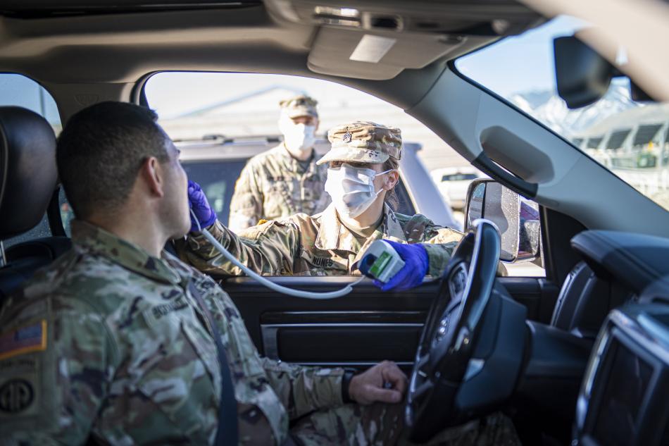 Staff Sgt. Jennifer Nunes takes temperatures of Nevada Military Department employees.