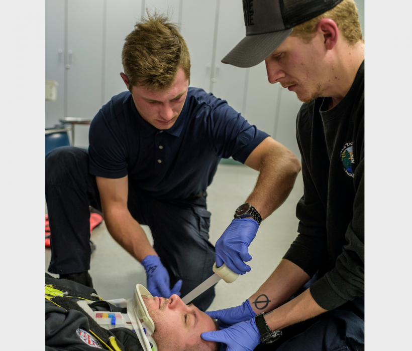 Trae Workman and Justin Bardling practice emergency medical technician skills last spring.