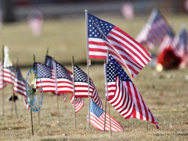 Photo by Brett Fisher. Flags placed on graves at Lone Mountain Cemetery in Carson City.