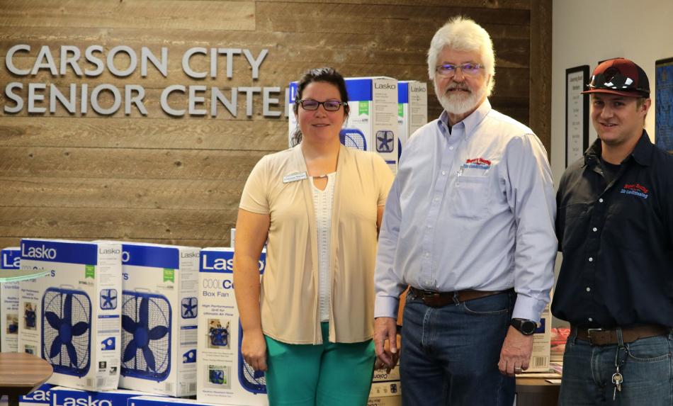 Dirk Roper of Roper’s Heating and Air Conditioning with Courtney Warner, executive director of the senior center.