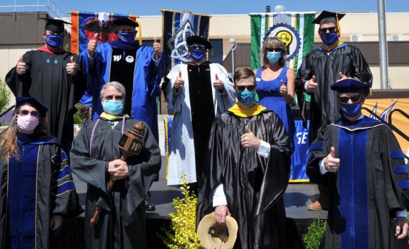 WNC campus leaders pose for a photo following the college’s safety-minded drive-through graduation ceremony last month.