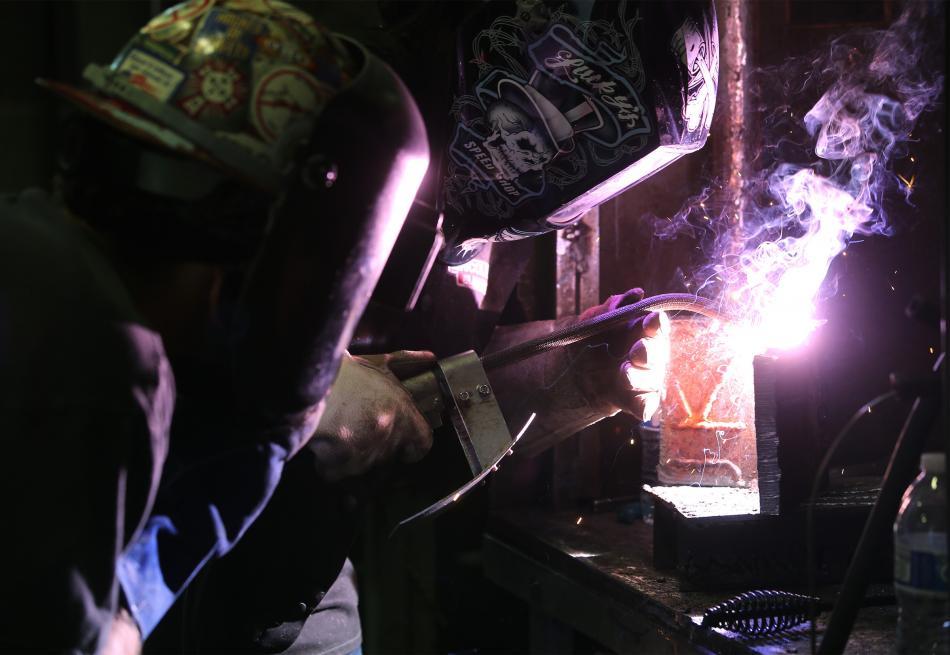 Chase Thompson watches as Candi Gray welds in a Western Nevada College welding class in Carson City.