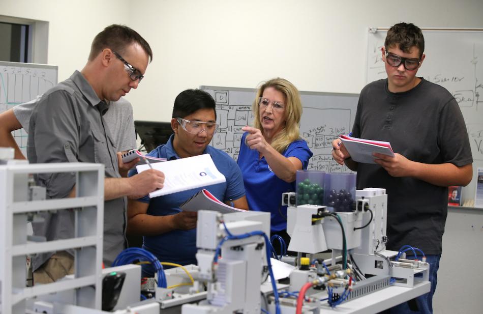 Professor Emily Howarth works with Mechatronics students during a 2018 class at Western Nevada College in Carson City.