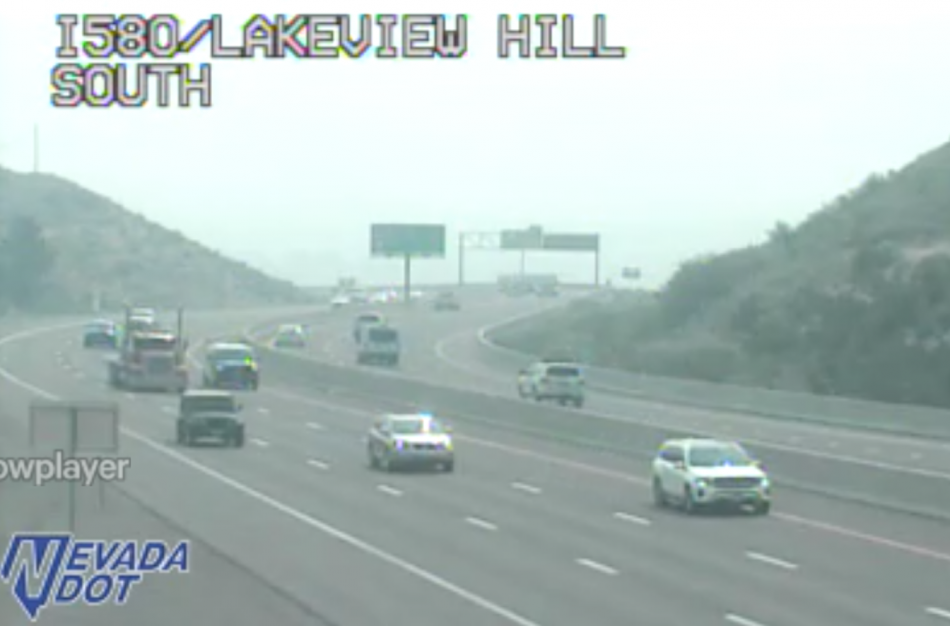 NDOT's traffic cam at 10:40 a.m. shows smoke over Carson City and into Washoe Valley at I-580 and Lakeview
