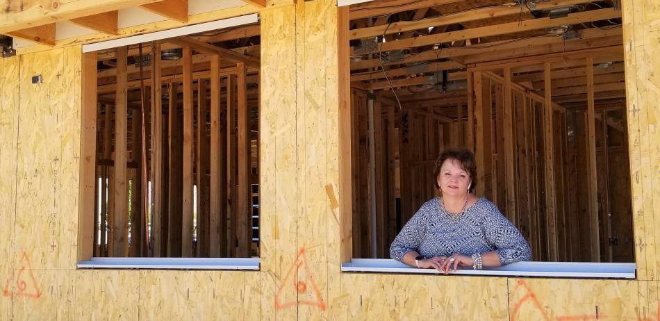 Advocates to End Domestic Violence Executive Director Lisa Lee looks out of what will soon be her new office window.
