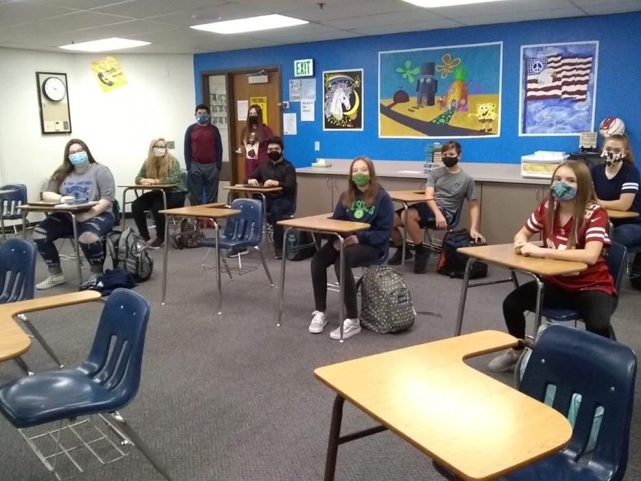 CHS students smiling behind their masks.