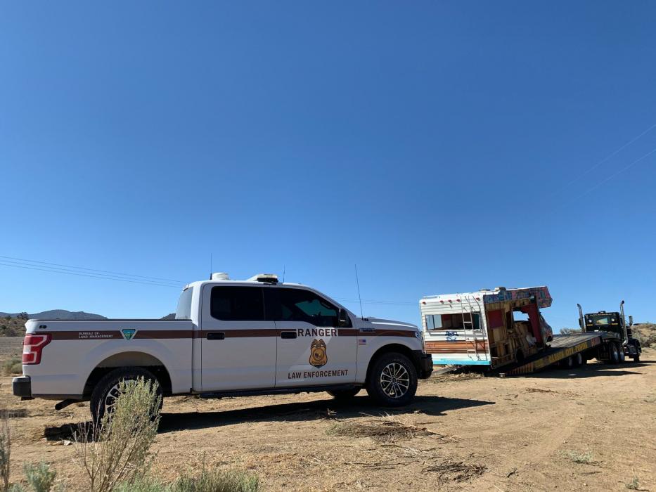 The U.S. Bureau of Land Management removes an abandoned RV in Mound House area.