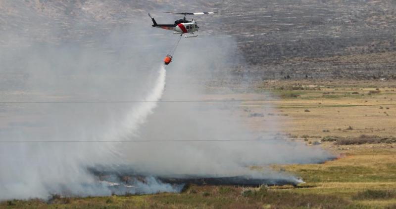 U.S. Forest Service photo of a helicopter water drop on the Slink Fire.
