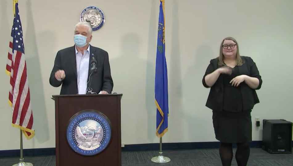 Governor Sisolak and a hearing impaired interpreter Thursday during a press conference.