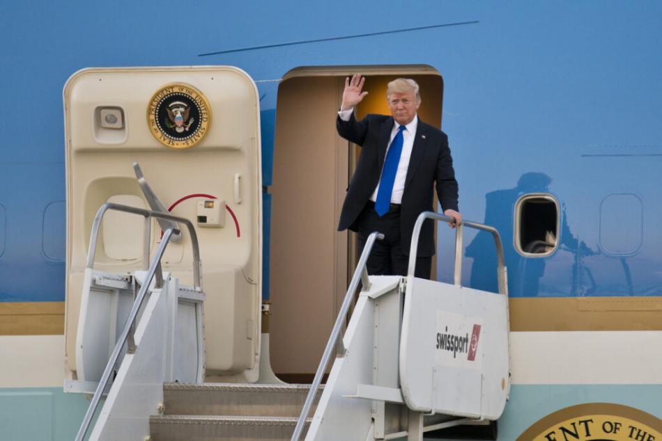 President Donald Trump waves while exiting Air Force One at McCarran International Airport in Las Vegas on Thursday, Sept. 20, 2