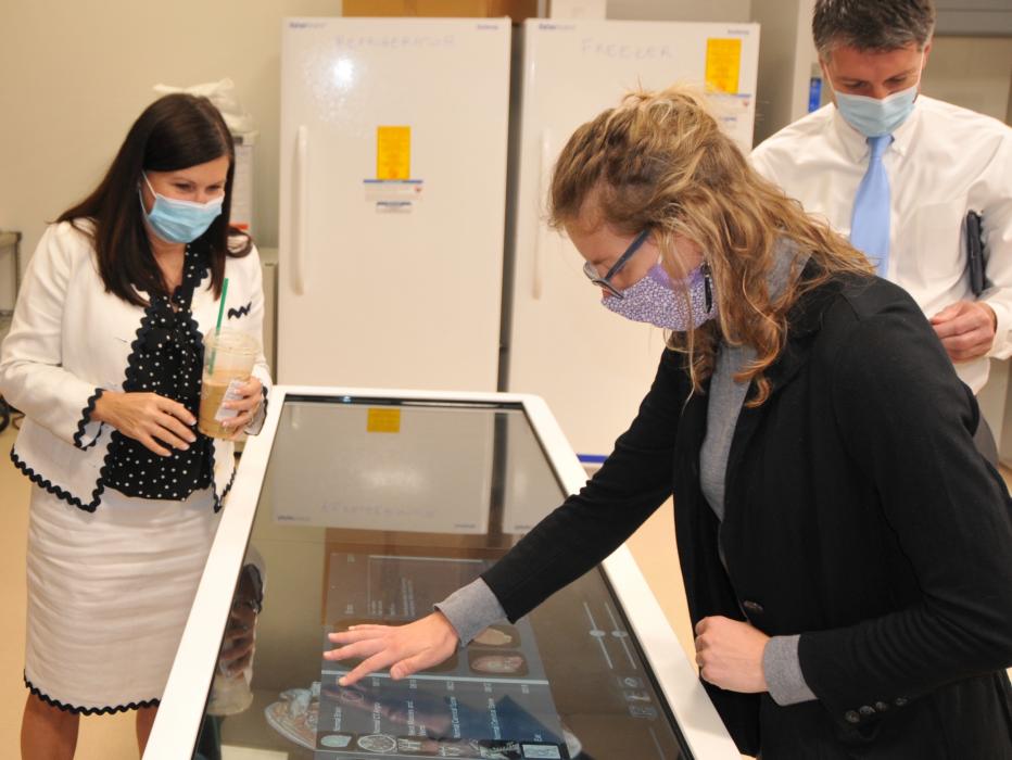 WNC Biology Professor Rachelle Bassen, right, demonstrates to Chancellor Dr. Melody Rose some specifics of her department.