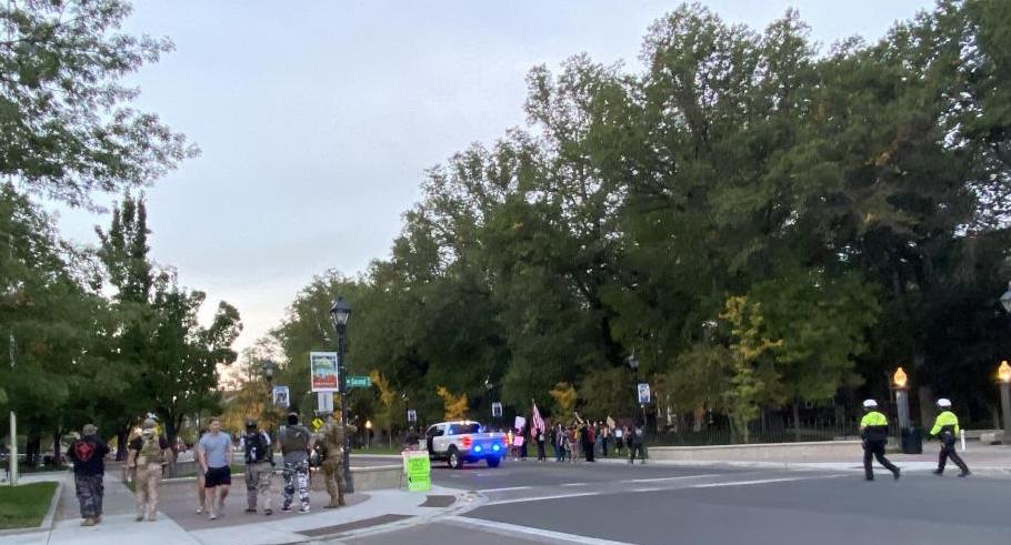 Demonstrators gathered Saturday near the state legislature. Three were arrested for standing in the roadway and obstructing.