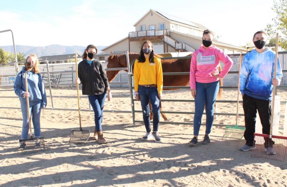 CHS Cadets helping with cleaning, repairs, and working with the Kids and Horses Horseback Riding Therapy Center.