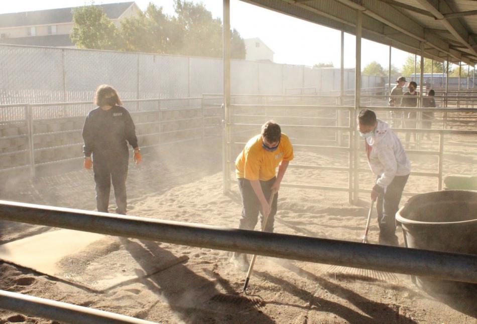 CHS Cadets helping with cleaning up the stalls at the Kids and Horses Horseback Riding Therapy Center.