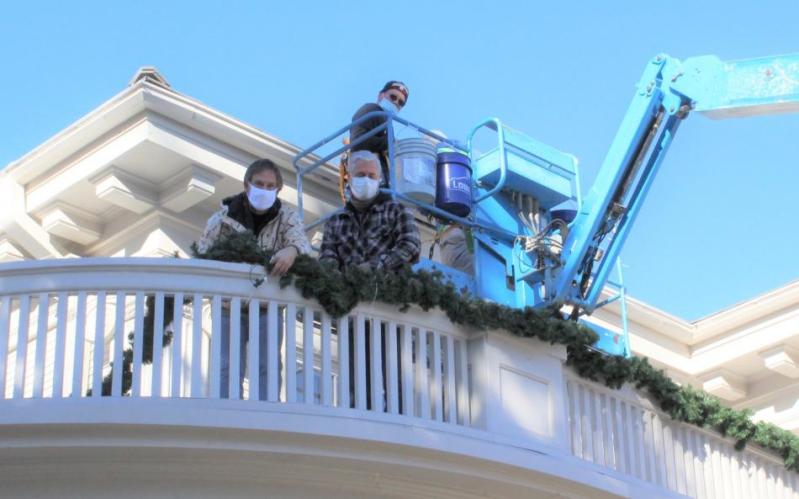 Volunteers who rose early this past Saturday to help the limited state buildings and grounds staff decorate the mansion.