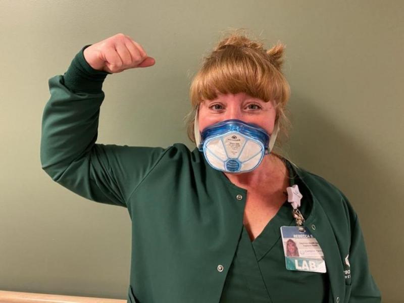 Rebecca Strong with Envo Mask. In the second photo is Ryanne K. Walther, MD, ER and Charito Gonzales, ICU Nurse.