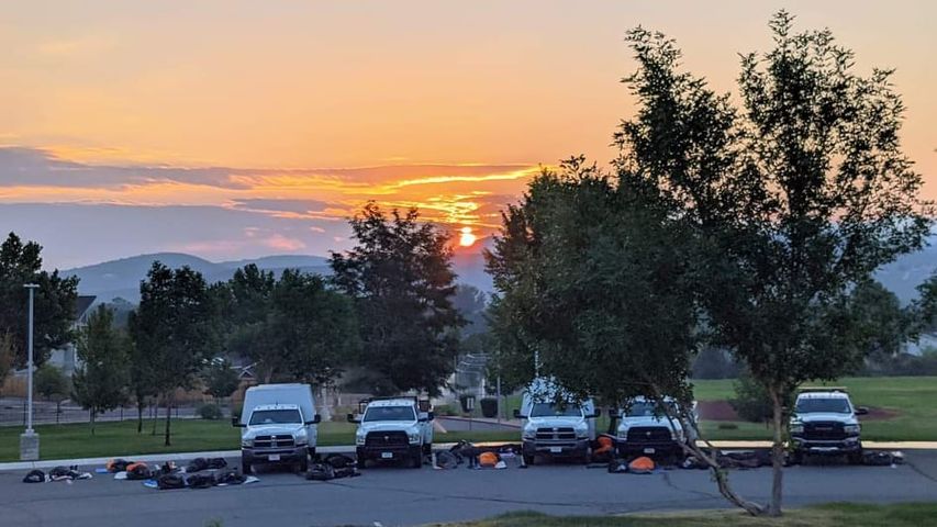 Photo by Cindy Towles; firefighters sleep in Eagle Valley parking lot early Saturday morning
