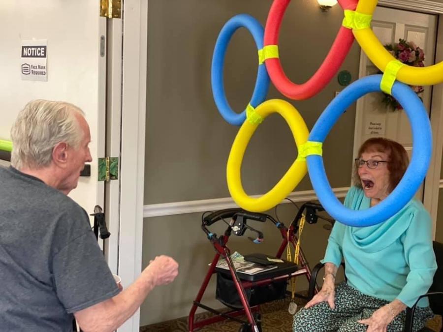 Dottie Pritchard and Mike Andersen win Carson Valley Senior Living Olympic-inspired goldfish throwing contest.