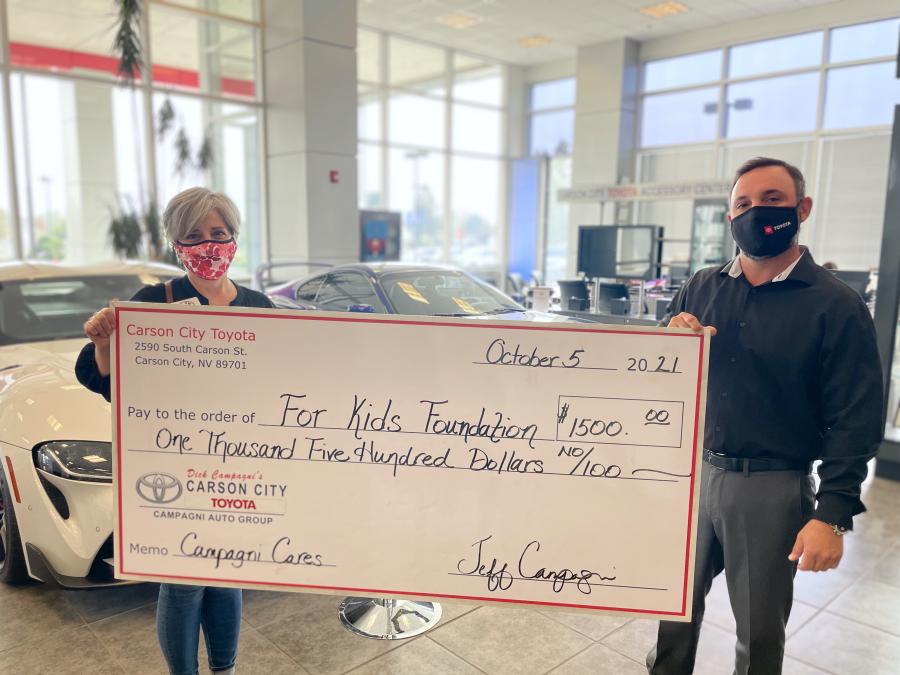General Manager of Carson City Toyota, Jeff Campagni, presents a check to For Kids Foundation Director, Annie Goni-Stewart