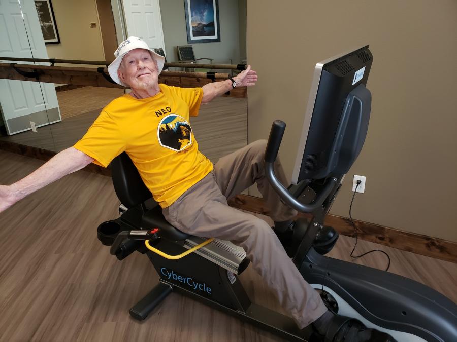 Carl Bumpas completes a ride on Mountain Lakes Estates’ CyberCycle, a stationary bike offering virtual tours & group rides.