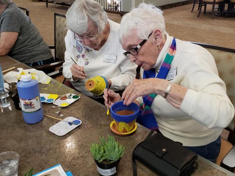 Residents Loretta Ward (left) and Gini Sunnergren rediscover their inner artists and green thumbs at Mountain Lakes Estates.