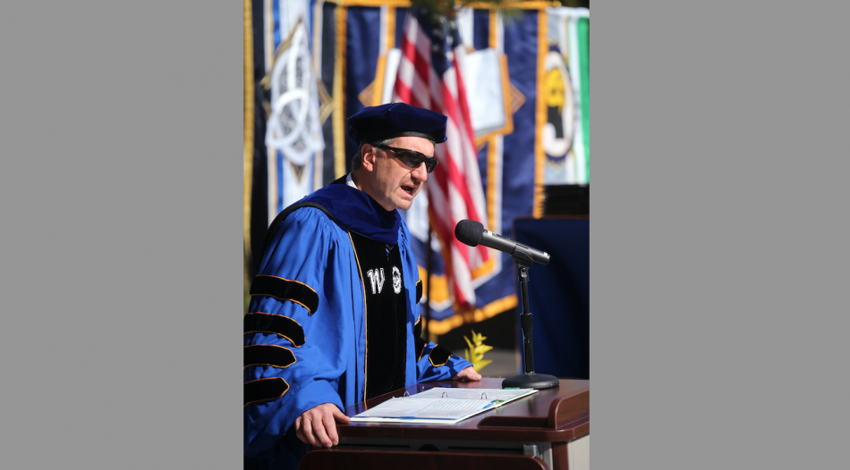 WNC Interim President Dr. J. Kyle Dalpe opens the 2022 drive-through commencement ceremony with a speech on Monday.