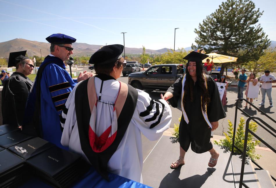 WNC graduate Elena Reyes Banuelos of Carson City participates in a drive-through commencement ceremony.