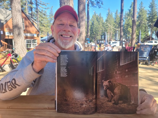 Toogee Sielsch with a copy of the July National Geographic magazine he had a part in.