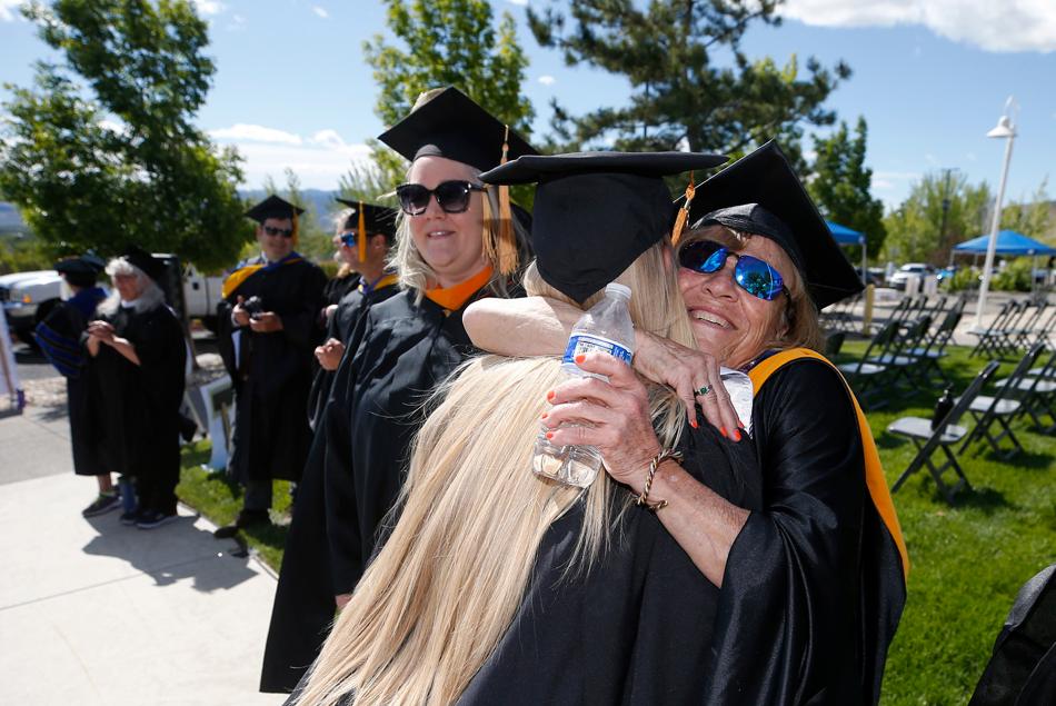WNC 2021 commencement Edda Gibson hugging grad.