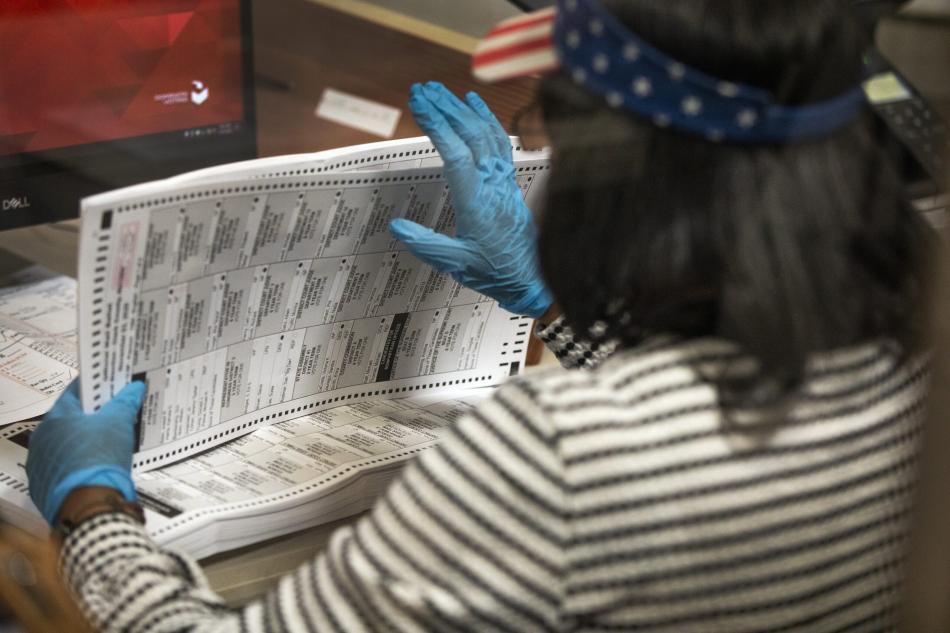 Clark County Election Department personnel process mail in ballots on Friday, Oct. 30, 2020. Jeff Scheid/The Nevada Independent