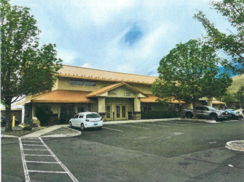 The proposed site is inside the office park next to Red's Old 395 Grill
