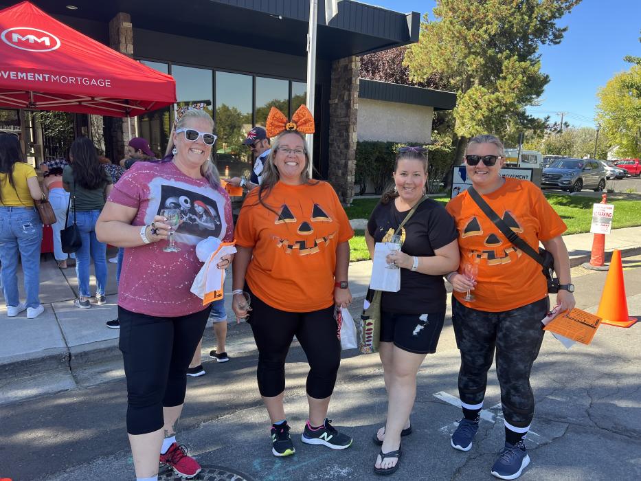 Shiloh, Connie, Michelle and Brenda smile for a picture with their Halloween outfits.