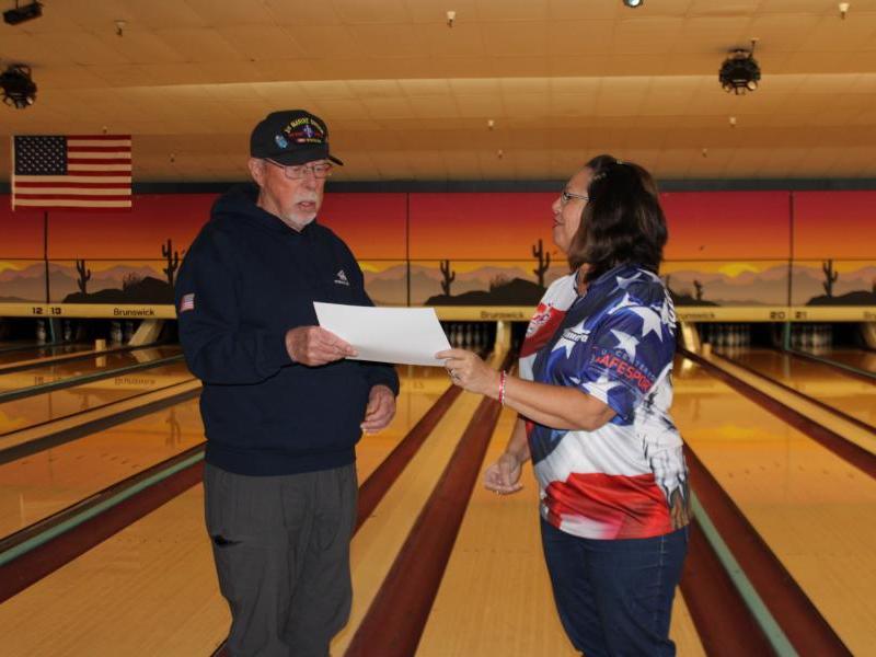 Check presentation from bowlers to Veteran's Guest House.