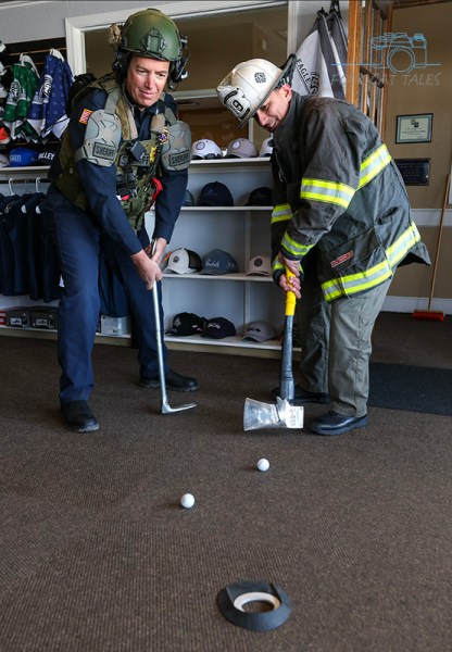 Board members Jason Danen and Daniel Gonzales promote the upcoming golf tourney. Photo by Cathleen Allison