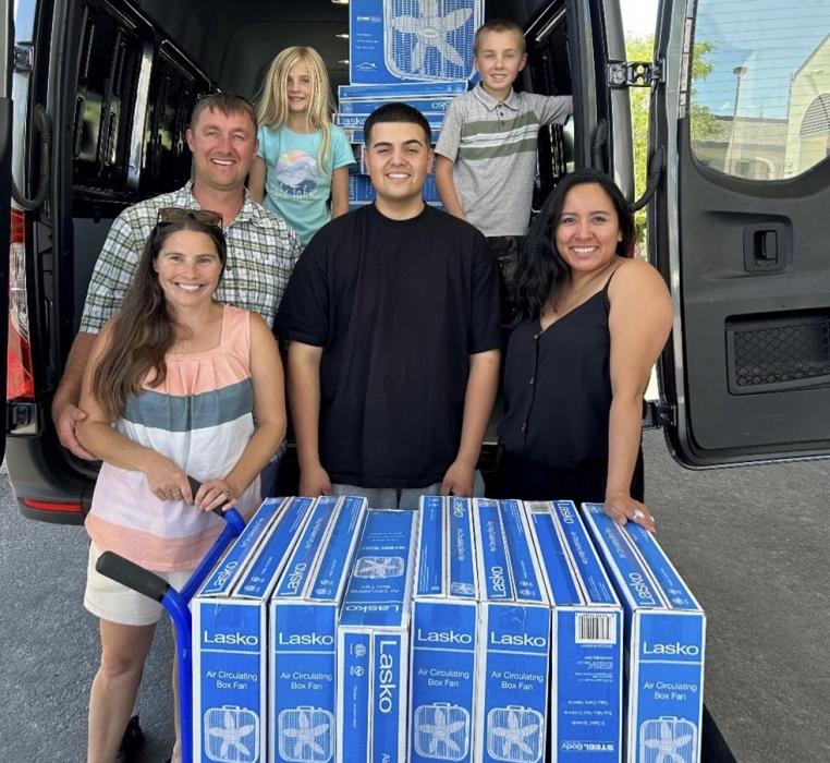 Cassi, Andy, Avi, Anthony, Haven, Karina unloading 70 fans donated to the Carson City Senior Center
