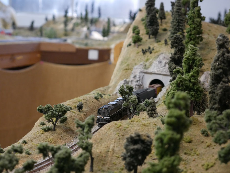 Locomotive emerges from tunnel.