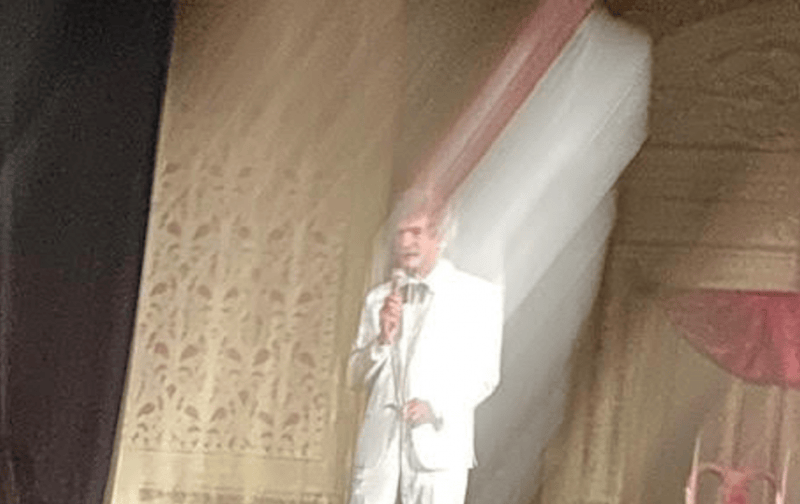 McAvoy as Mark Twain tells a story under the lights.