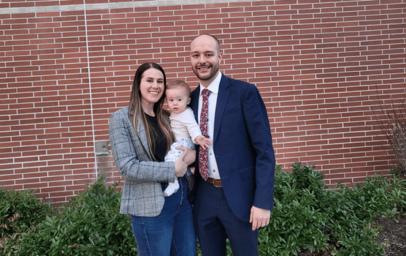 Tyson League, his wife Emily, and son Maze pose outside of the Courthouse after filing for election.