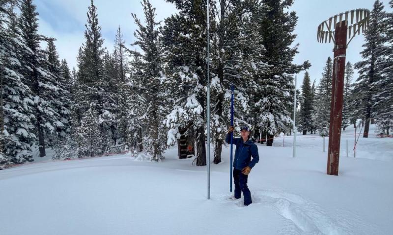 State hydrologist Jeff Anderson measures the snowpack at Mount Rose Summit on Feb. 8, 2024. (Amy Alonzo/The Nevada Independent)