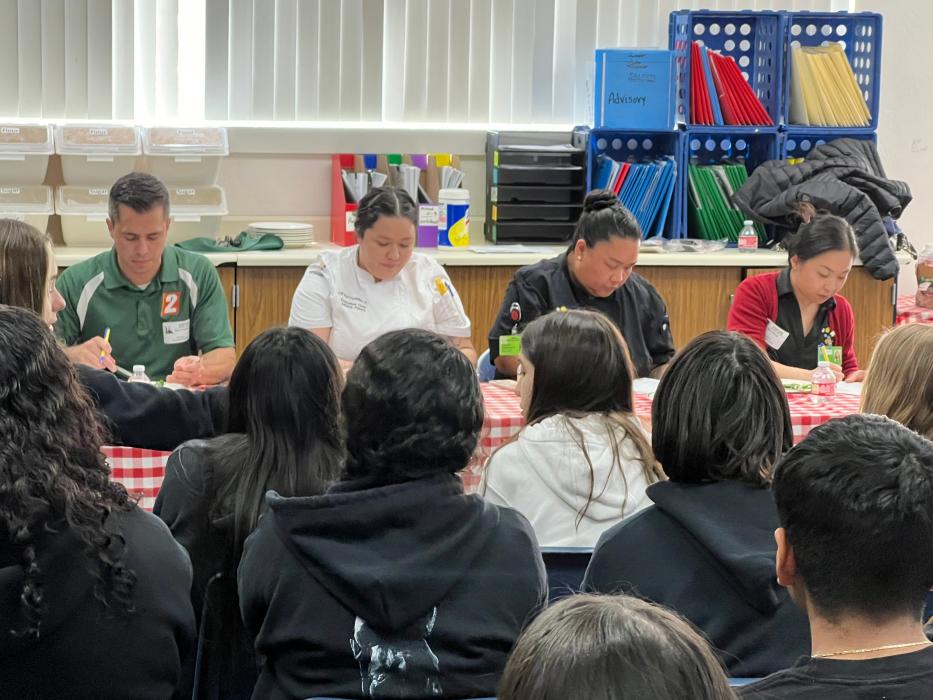 Judges taste and rank each dish.