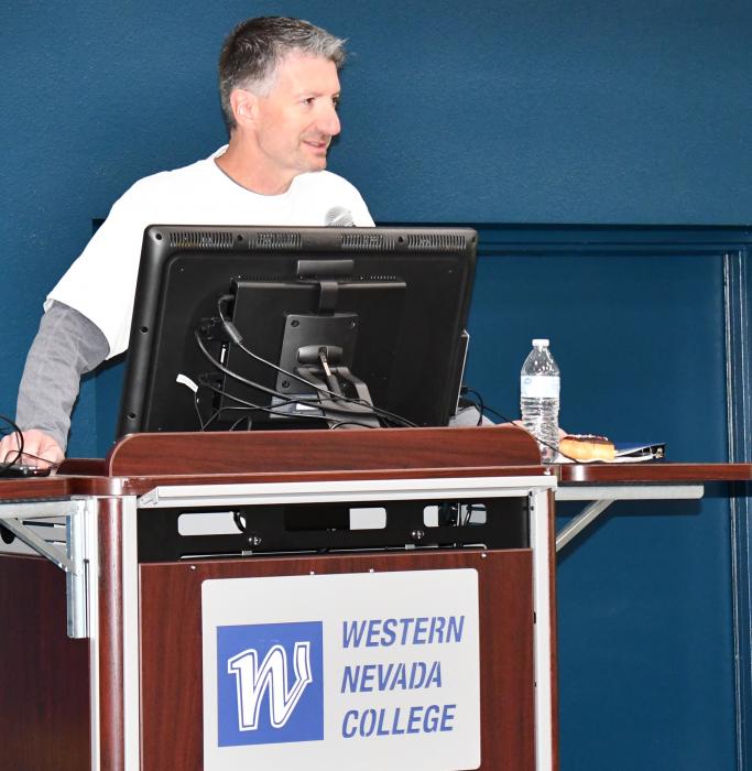 Western Nevada College President Dr. J. Kyle Dalpe high-fives participants in the Walk for Hope on Wednesday.