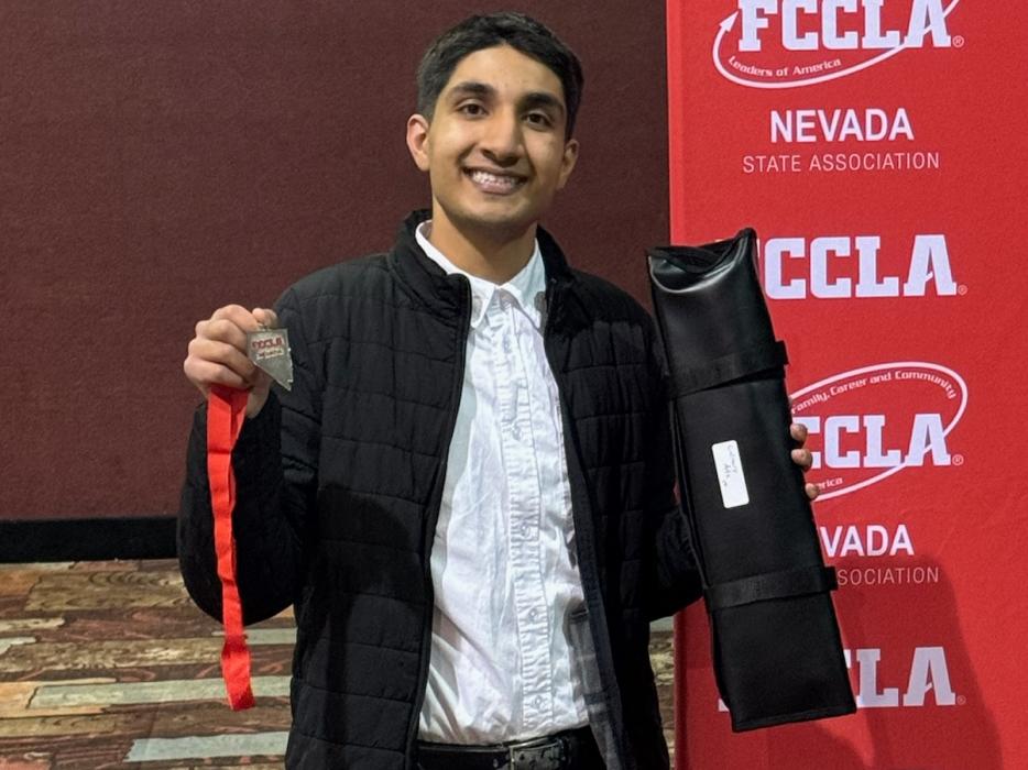 Rustam Thind receives medal.