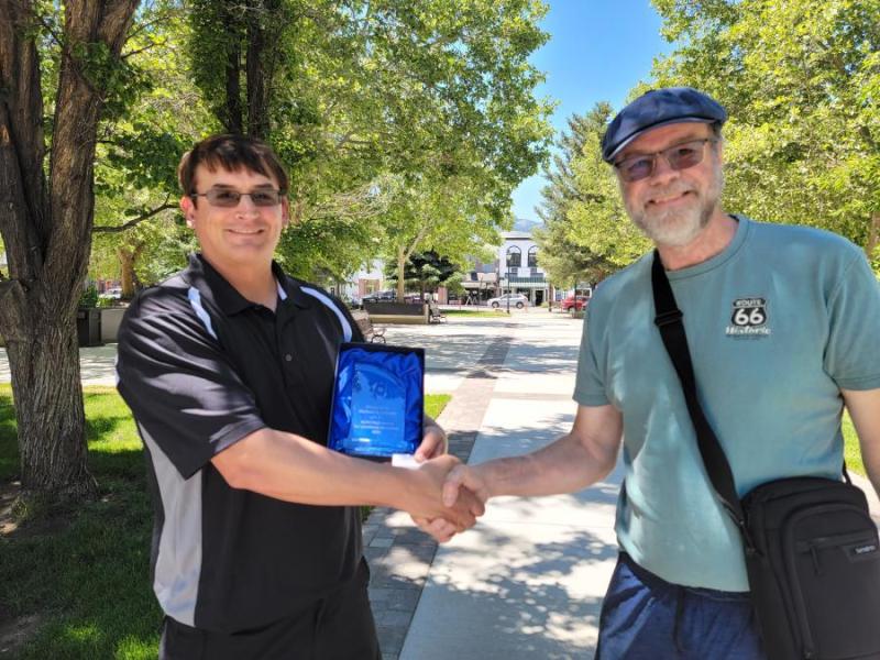 Carson City author Michael K. Falciani, left, receives the ACES High Award from