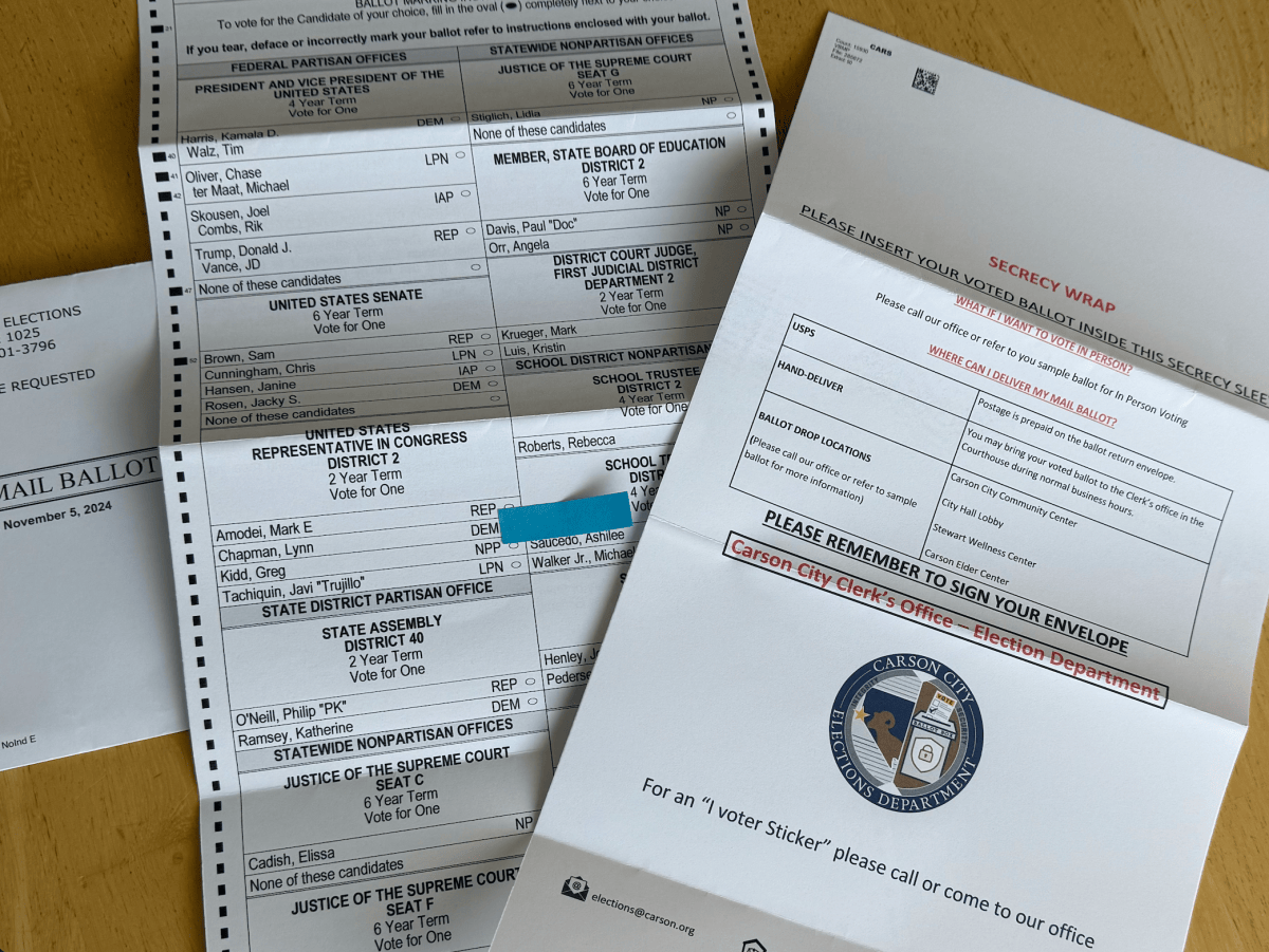 The 2024 ballot on a tabletop with a blue sticky note highlighting the incorrect party designation of a candidate.