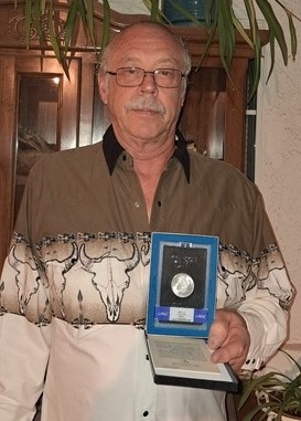 Dominic Durham of Tehachapi, CA shows the 1884 Morgan silver dollar that he won at the FNSM fund raiser.